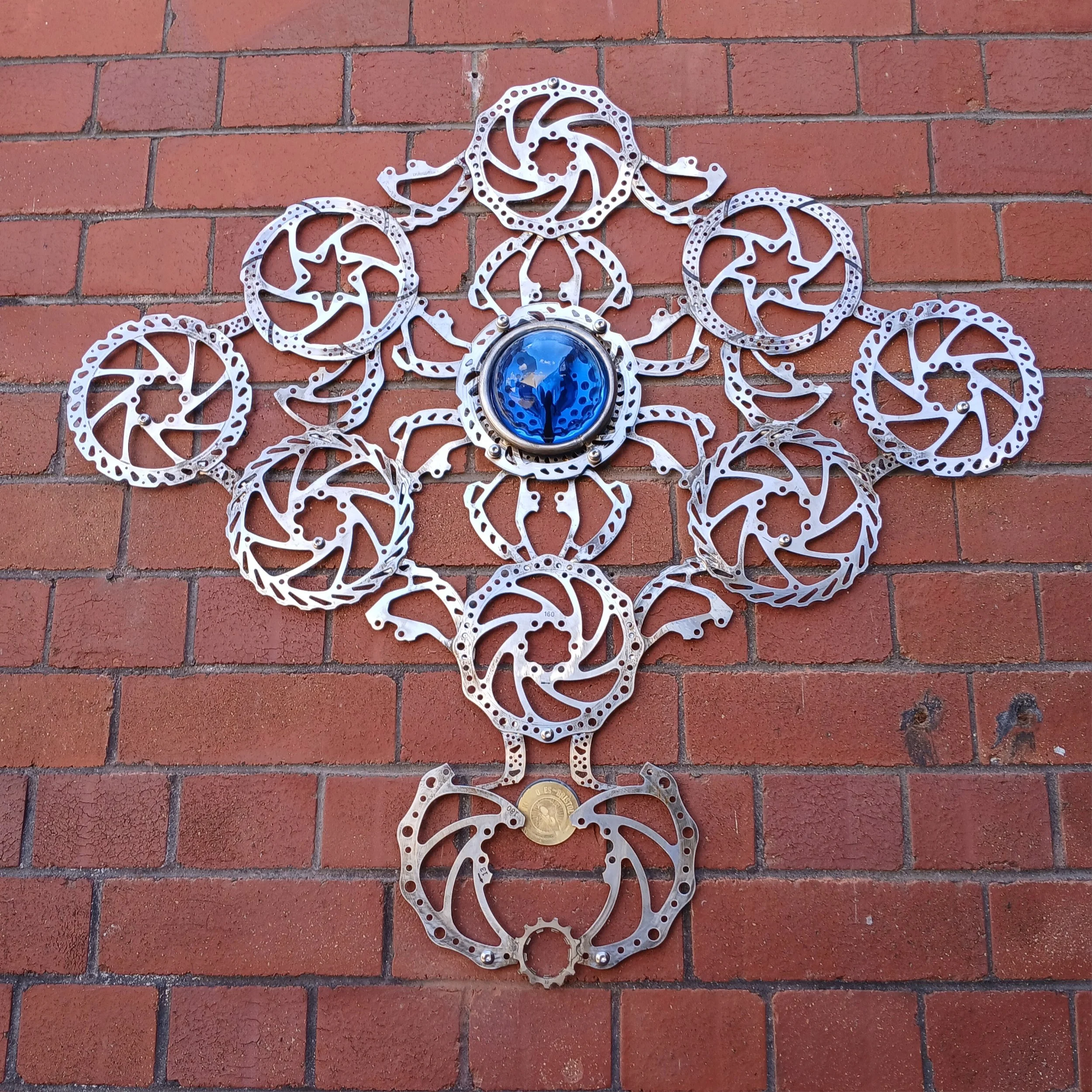 Blue crow mandala. Crow skull casted in resin and mandala made of brake rotors for UPFEST graffitti festival 2024