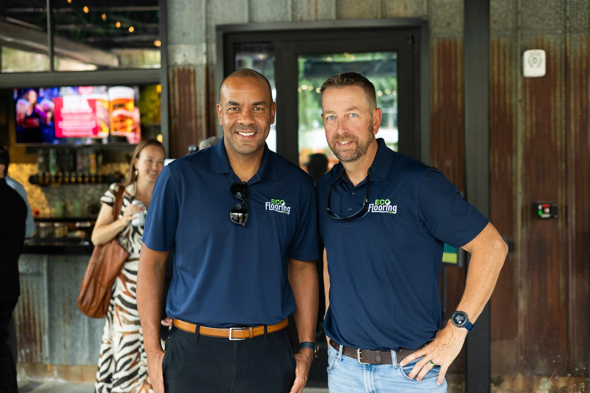 Two attendees posing together at an evening networking event, corporate event photography by Foundation Media Group