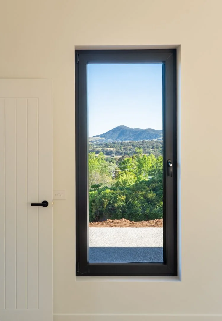 Window in house looking out over mountain