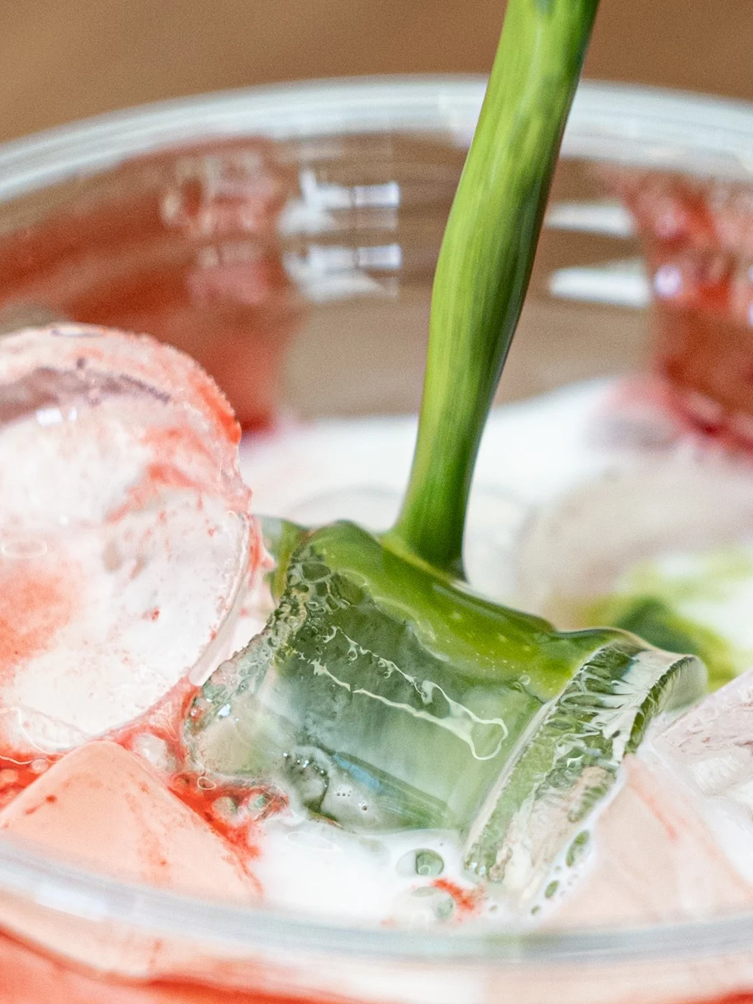 Matcha pouring into cup with ice