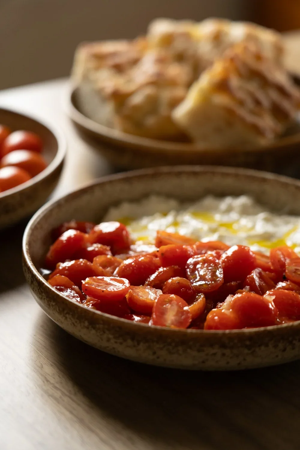 Plat with cheese and tomatoes sitting on table