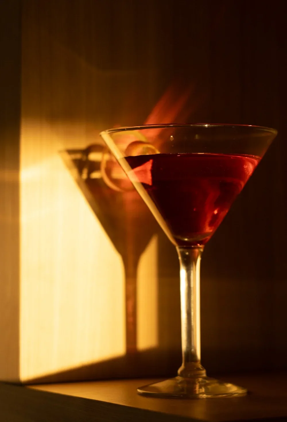 Cocktail glass sitting on table