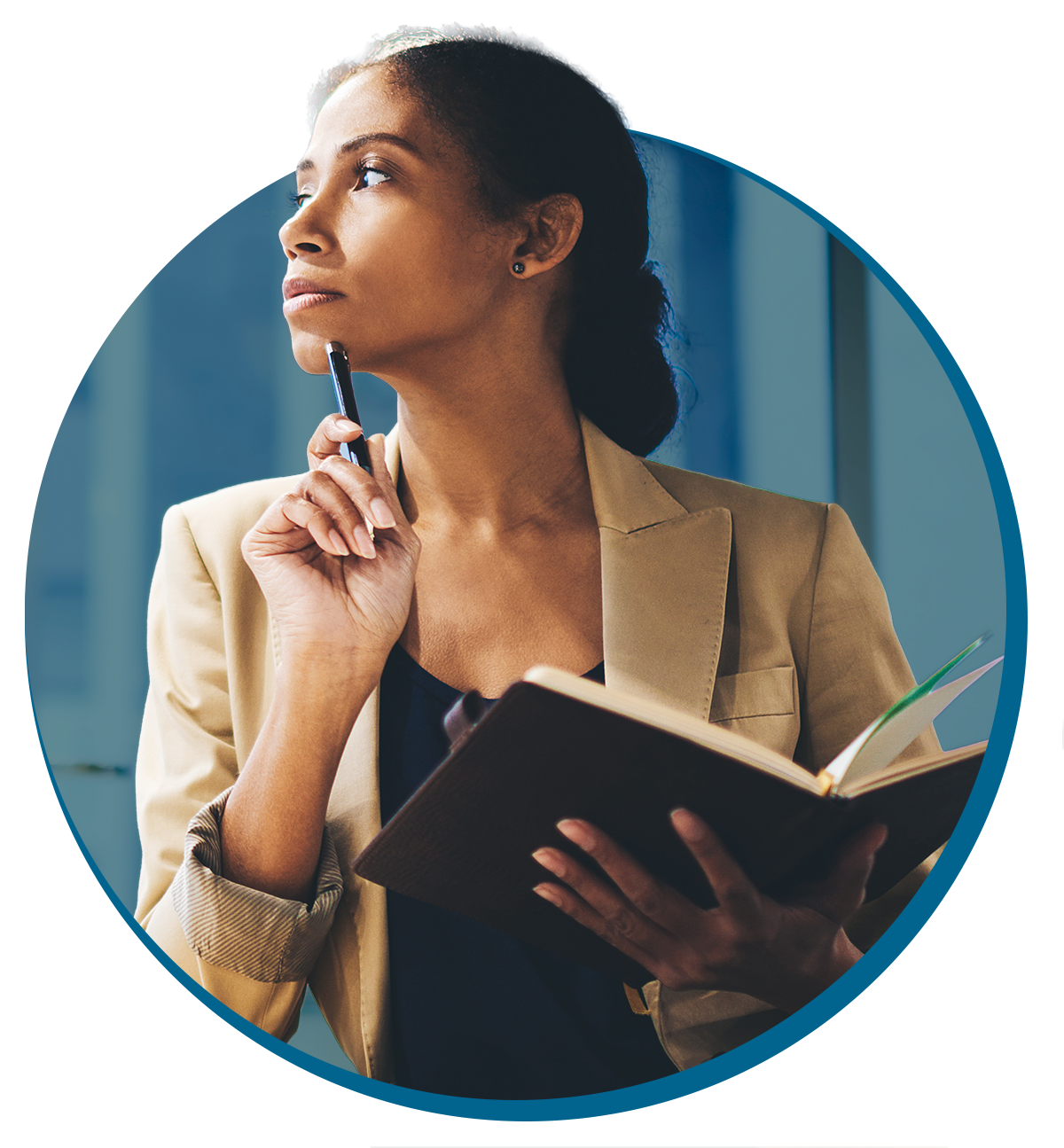 A professional woman with dark hair in a bun, wearing a beige blazer, holding a notebook and a pen, looking thoughtfully to the side, with her hand resting near her chin.