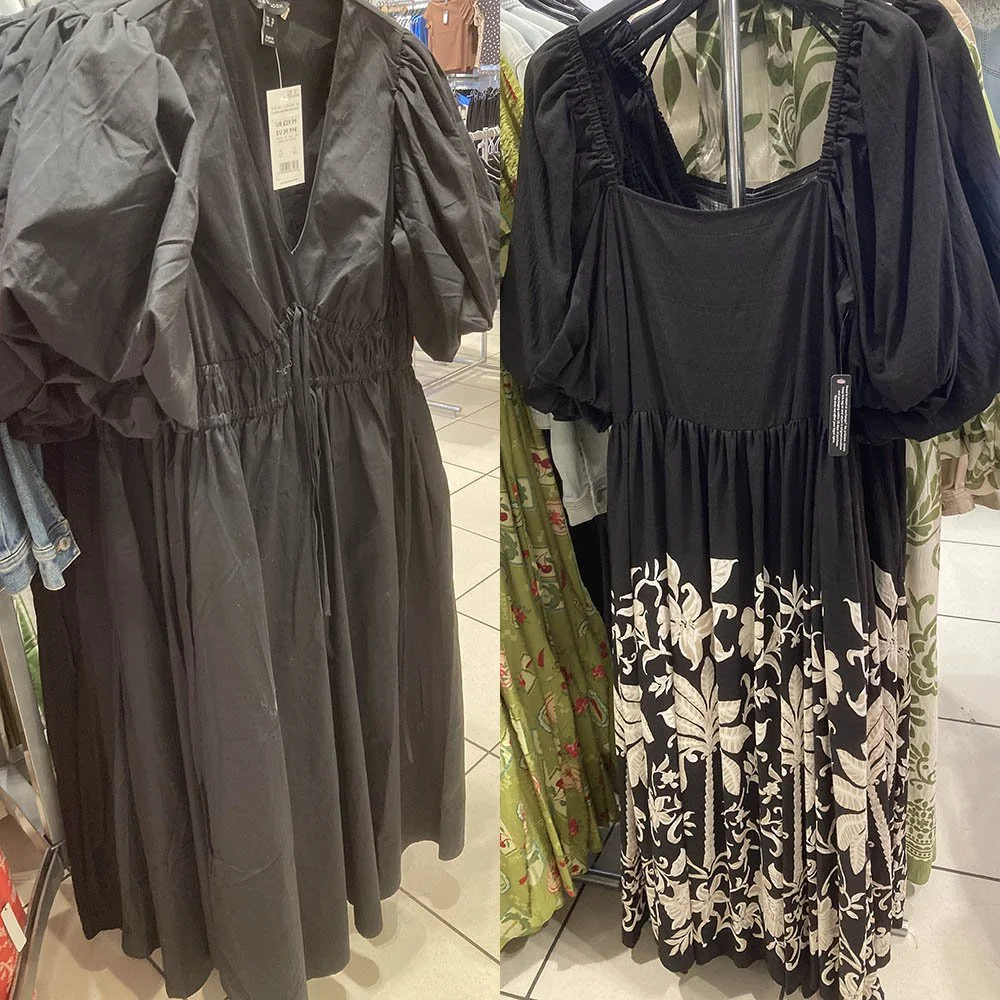 On the right a black dress with large puffy sleeves. On the right a black dress with a white floral pattern on the bottom of the skirt.