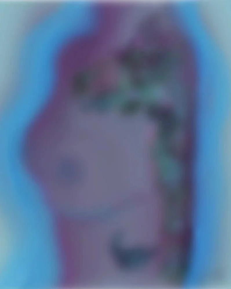 Blurred abstract image with shades of blue, purple, and green