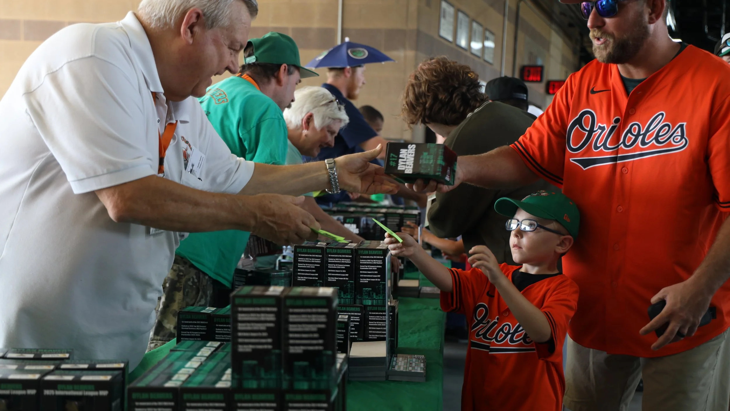 Norfolk, Virginia, 26 June 2026 - Swap: Two Tides fans exchange vouchers for Dylan Beavers bobblecards. Photo: Jesse Ankney