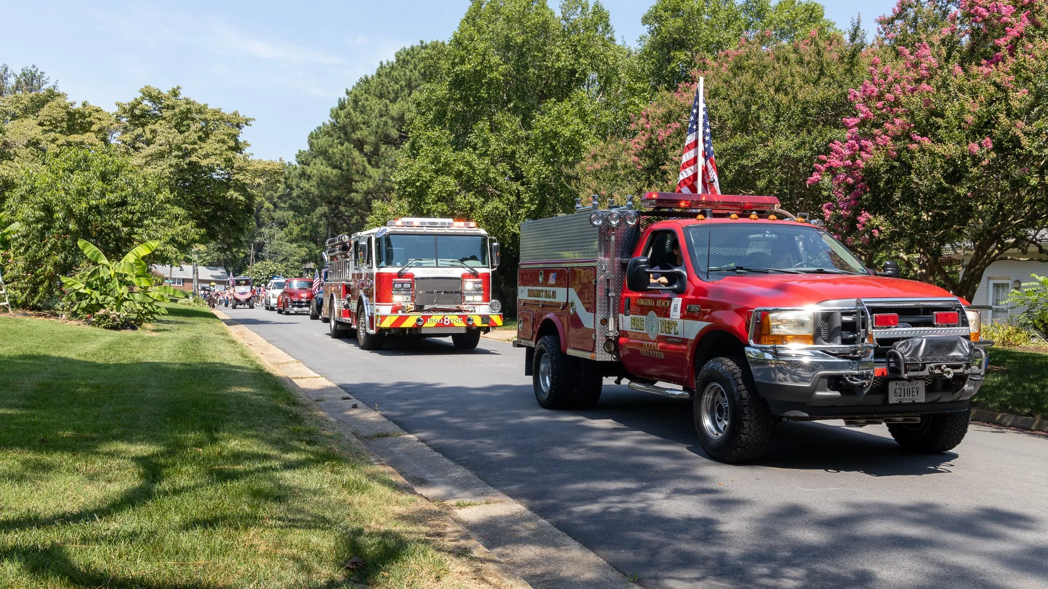 Virginia Beach, Virginia, 4 July 2026 -- Line Leader: Brush 8 and Engine 8 lead the Alanton neighborhood Independence Day parade. Photo: Jesse Ankney.