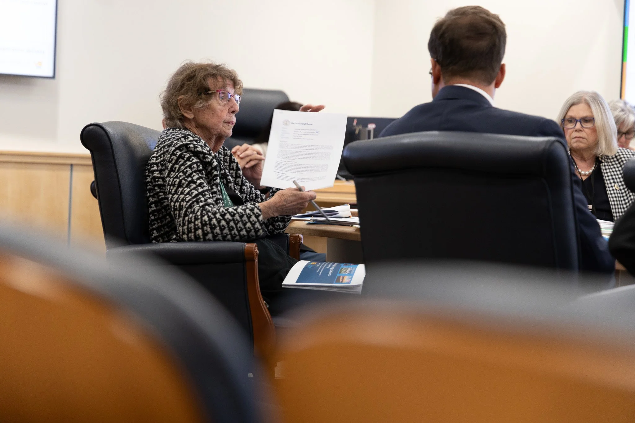 Barbara Henley holds up the current zoning ordinance definition of I-1 Light Industrial Districts