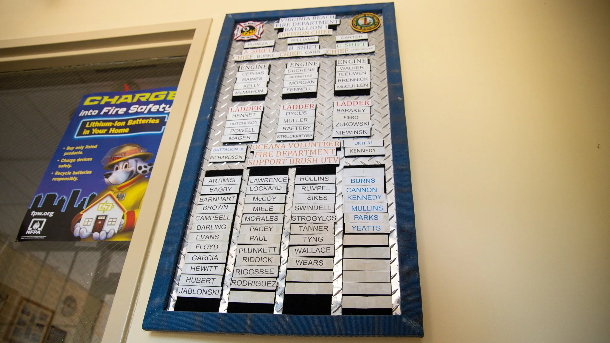 Virginia Beach, Virginia, 2 July 2026 -- Roll: Names of VBFD firefighters and OVFD volunteer support technicians on a board at the front of station 8. Photo: Jesse Ankney