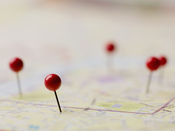 Map with several red pins marking locations.