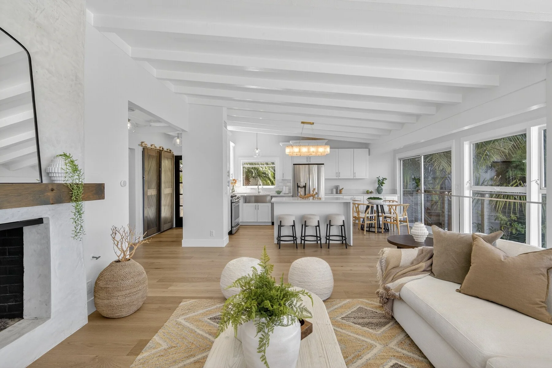 Open concept kitchen and living room with modern gas fireplace