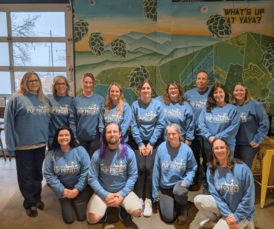 Group of LCPP volunteers at a team building event wearing matching logo'd sweatshirts