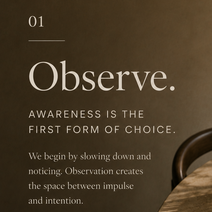 Inspirational quote about observing and awareness on a wall next to a wooden table and chair.