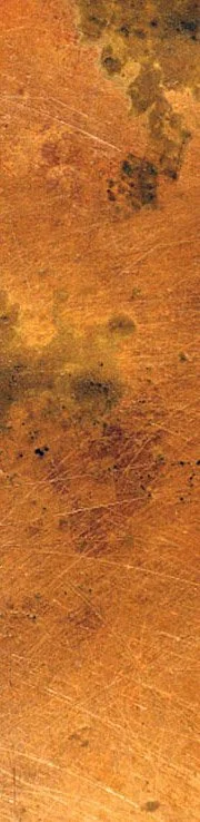 Close-up of a beautifully aged and burnished copper surface.