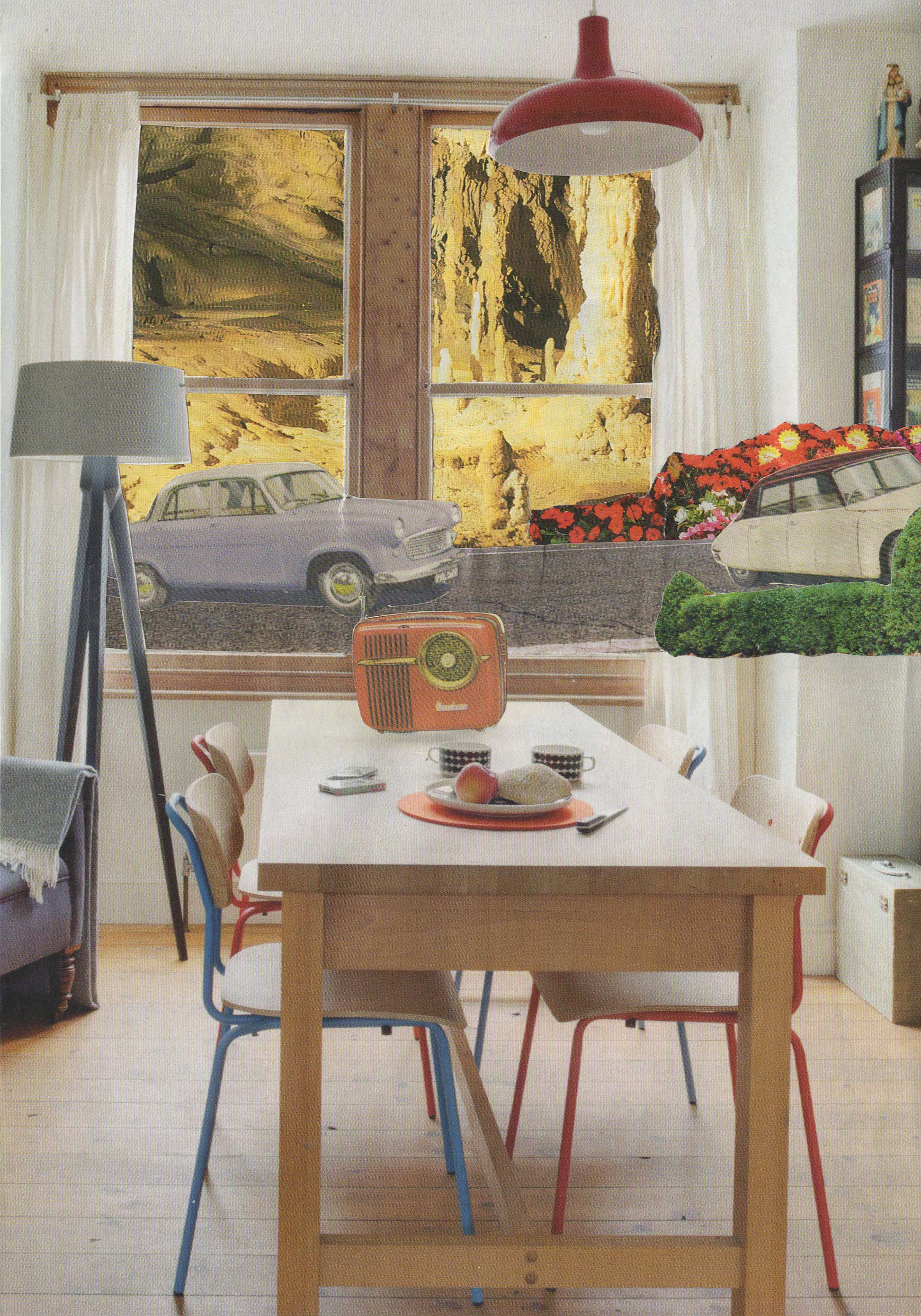 A cozy dining room with a wooden table, four chairs, a retro orange radio, and a window with scenic outdoor view of rocks and trees. There is a lamp and a bookshelf in the room.