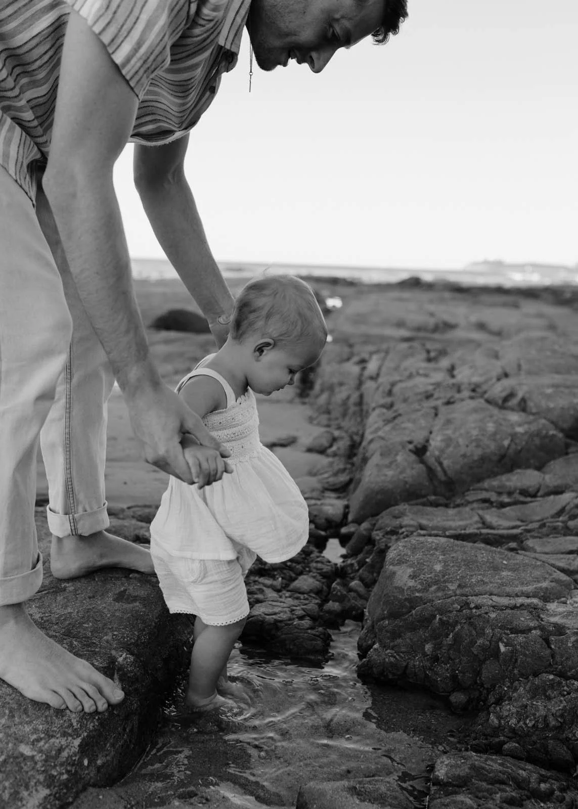 gold-coast-family-photographer-father-holding-baby.jpg