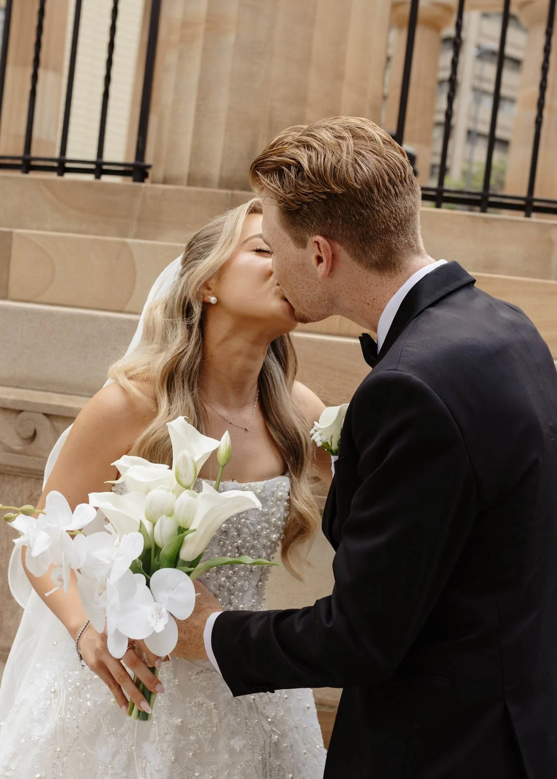brisbane-wedding-photographer-couple-kissing-ceremony.jpg
