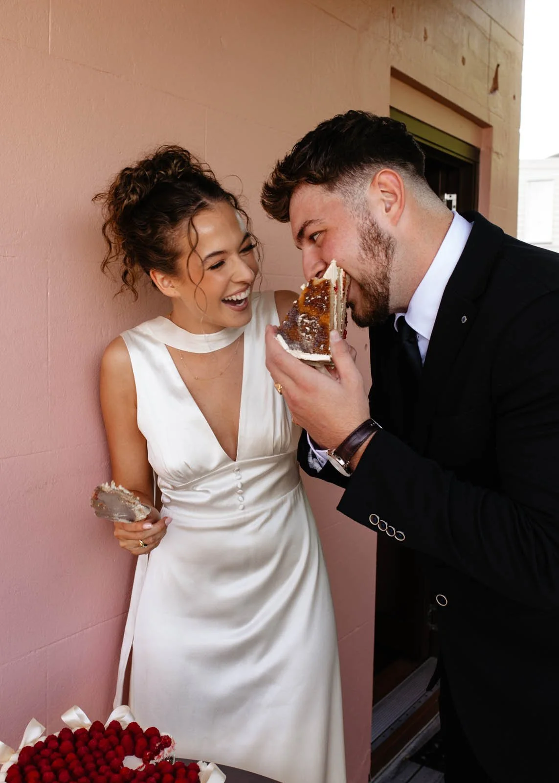 brisbane-wedding-photographer-couple-eating-cake-playful.jpg