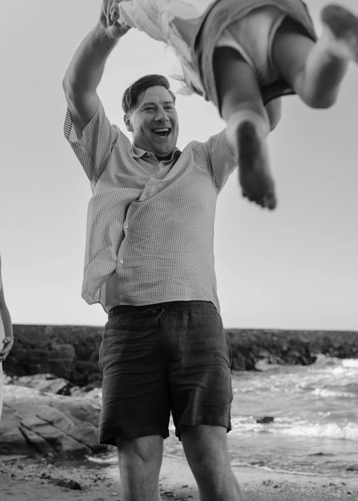 gold-coast-family-photographer-father-with-child-candid-moment-black-and-white.jpg