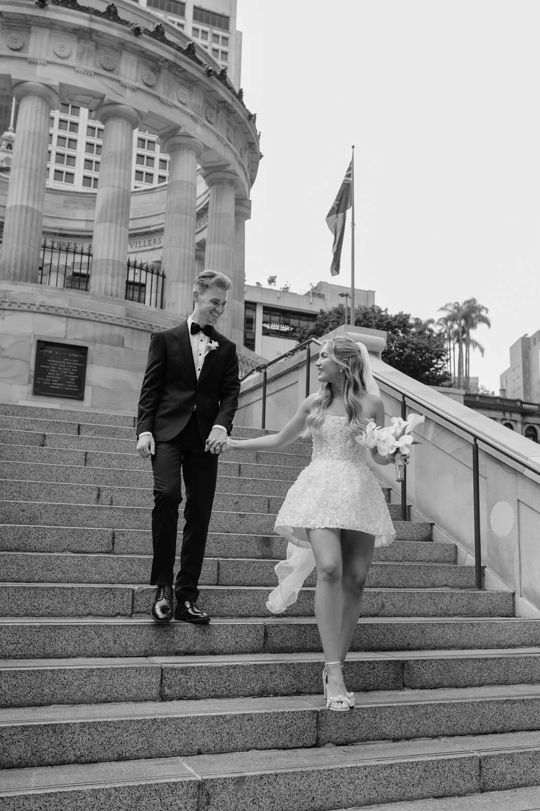 brisbane-wedding-photographer-couple-walking-steps-black-and-white.jpg