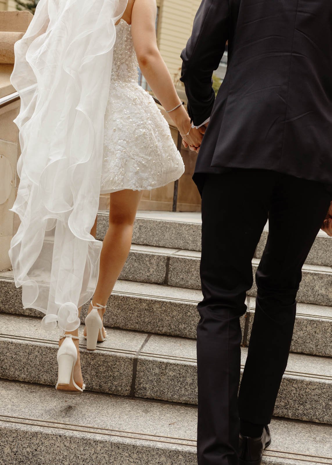 brisbane-wedding-photographer-couple-walking-up-steps.jpg