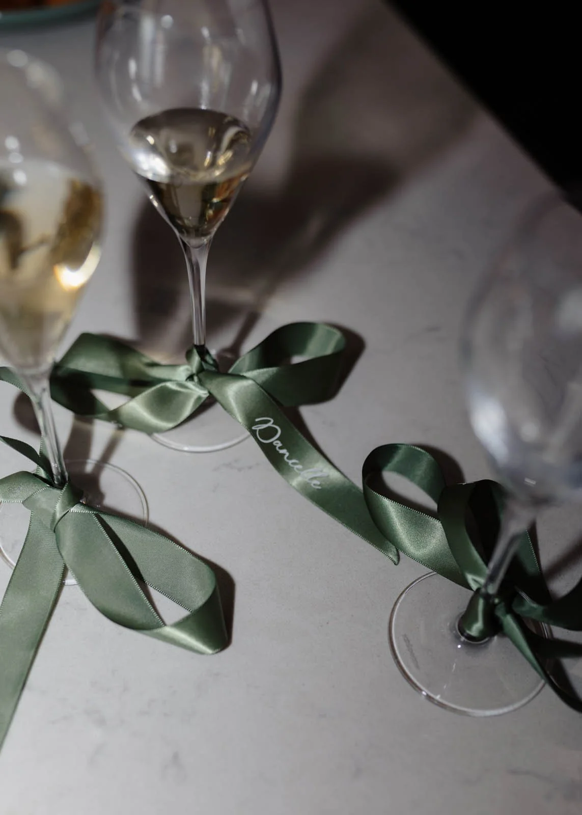 brisbane-wedding-photographer-champagne-glasses-with-ribbon-detail.jpg