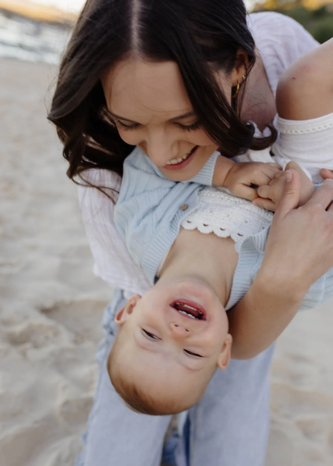 gold-coast-family-photographer-mother-hugging-baby-close.jpg