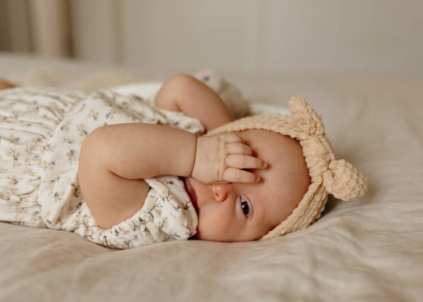 brisbane-newborn-photographer-baby-lying-on-bed-close-up.jpg