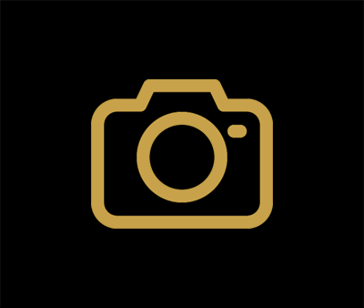 Placeholder icon of a camera in gold on a black background.