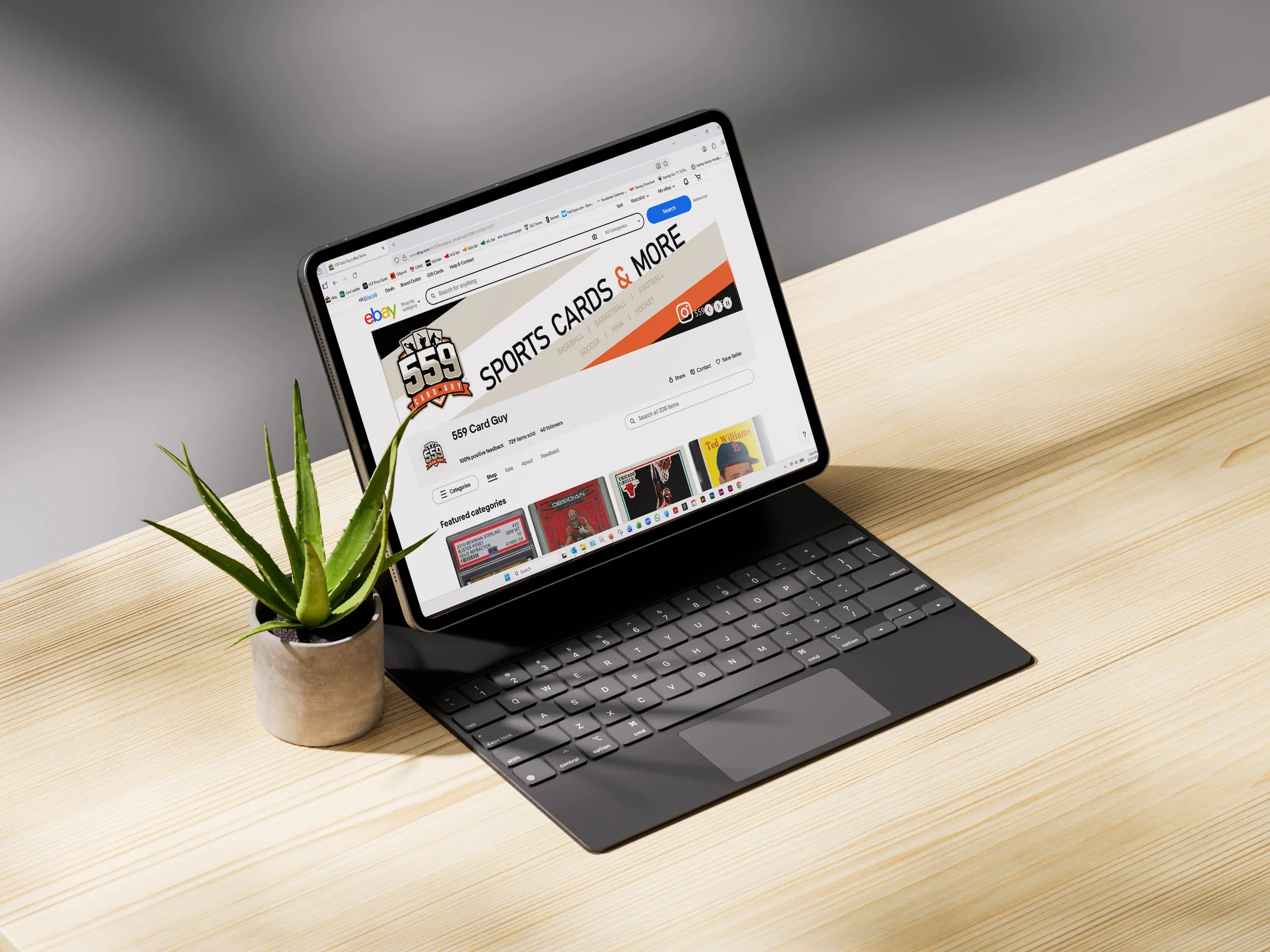 Laptop or tablet with 559 Card Guy ecommerce eBay store page displayed showing branding