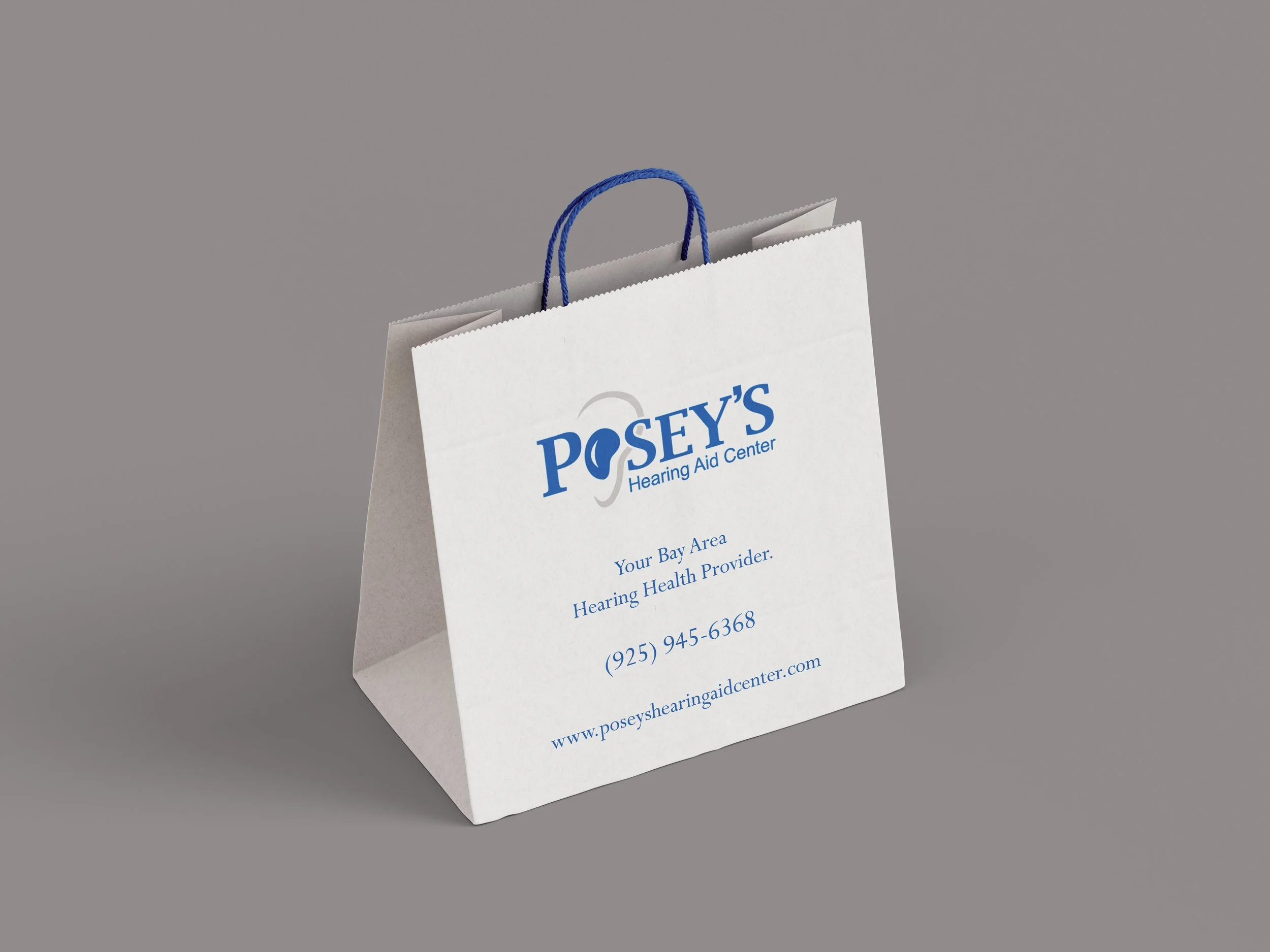 White paper shopping bag with full color logo printed on side