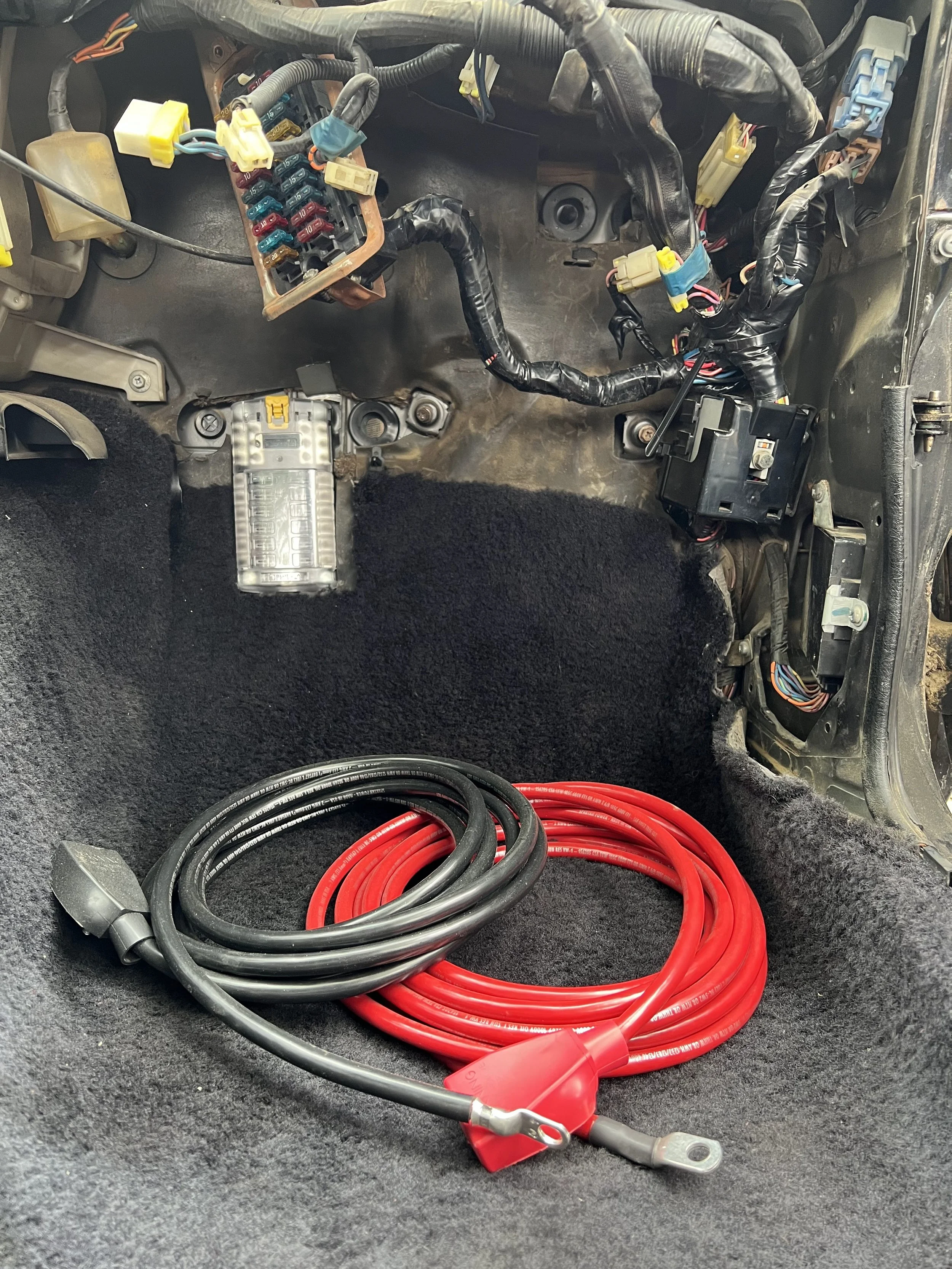 Preview of new battery cables ready for a battery relocation on a 1984 Nissan 200SX S12.
