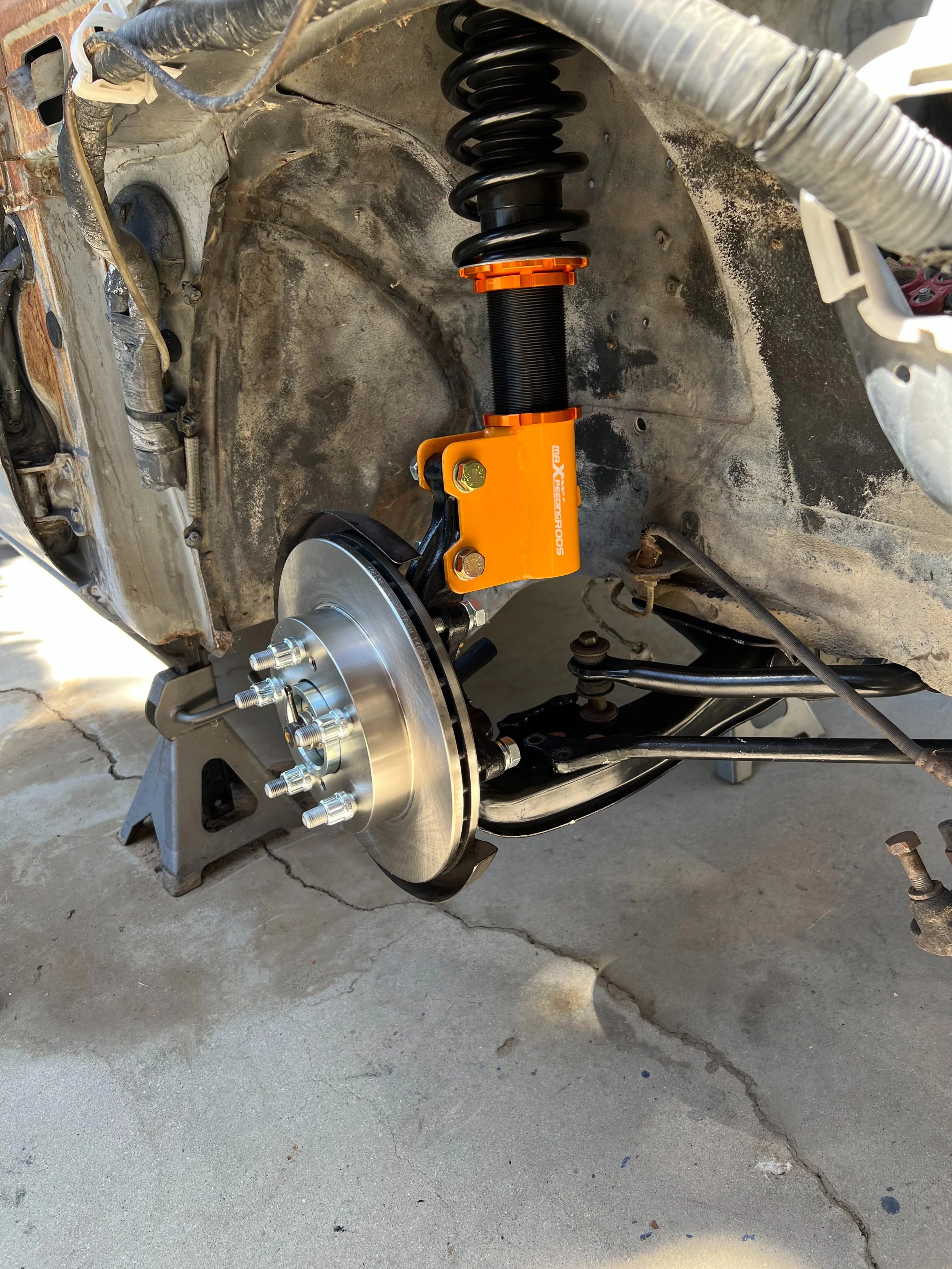 New Nissan S13 and Nissan S14 front suspension setup installed on a 1984 Nissan 200SX S12.