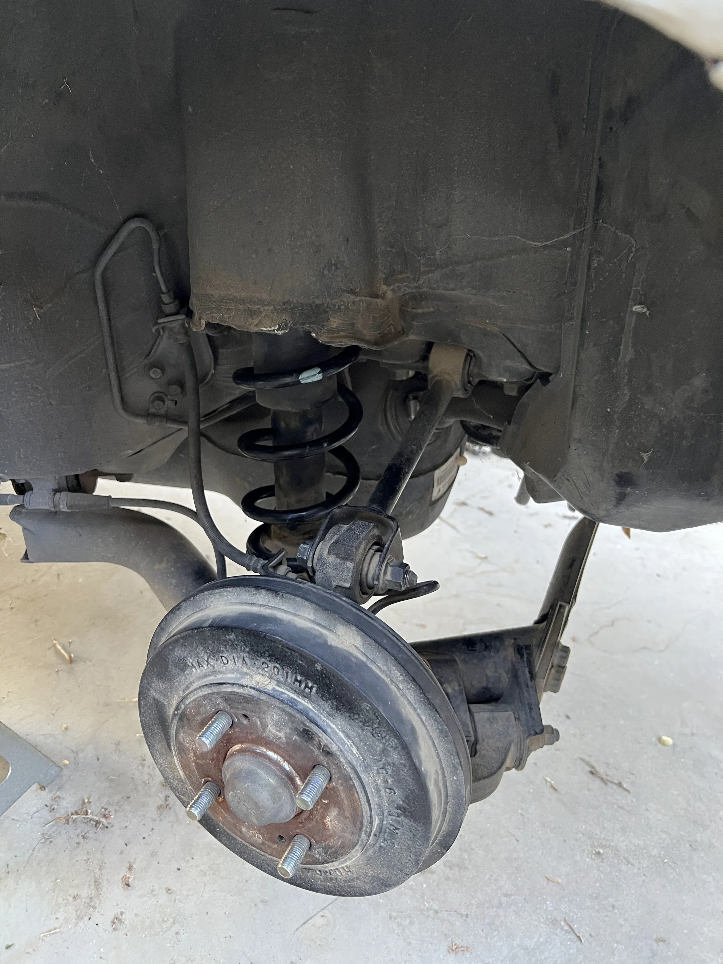 Overview of a 2001 Honda Civic's rear suspension after reinstalling the original rear suspension springs.