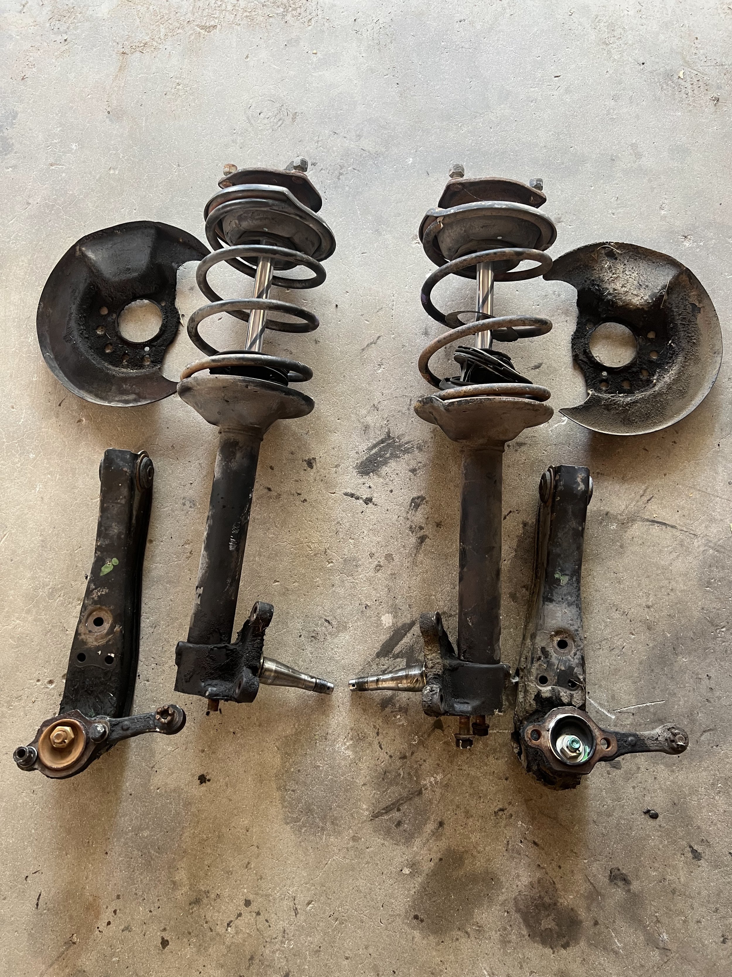 Overview of broken down 41 year old front suspension from a 1984 Nissan 200SX S12.