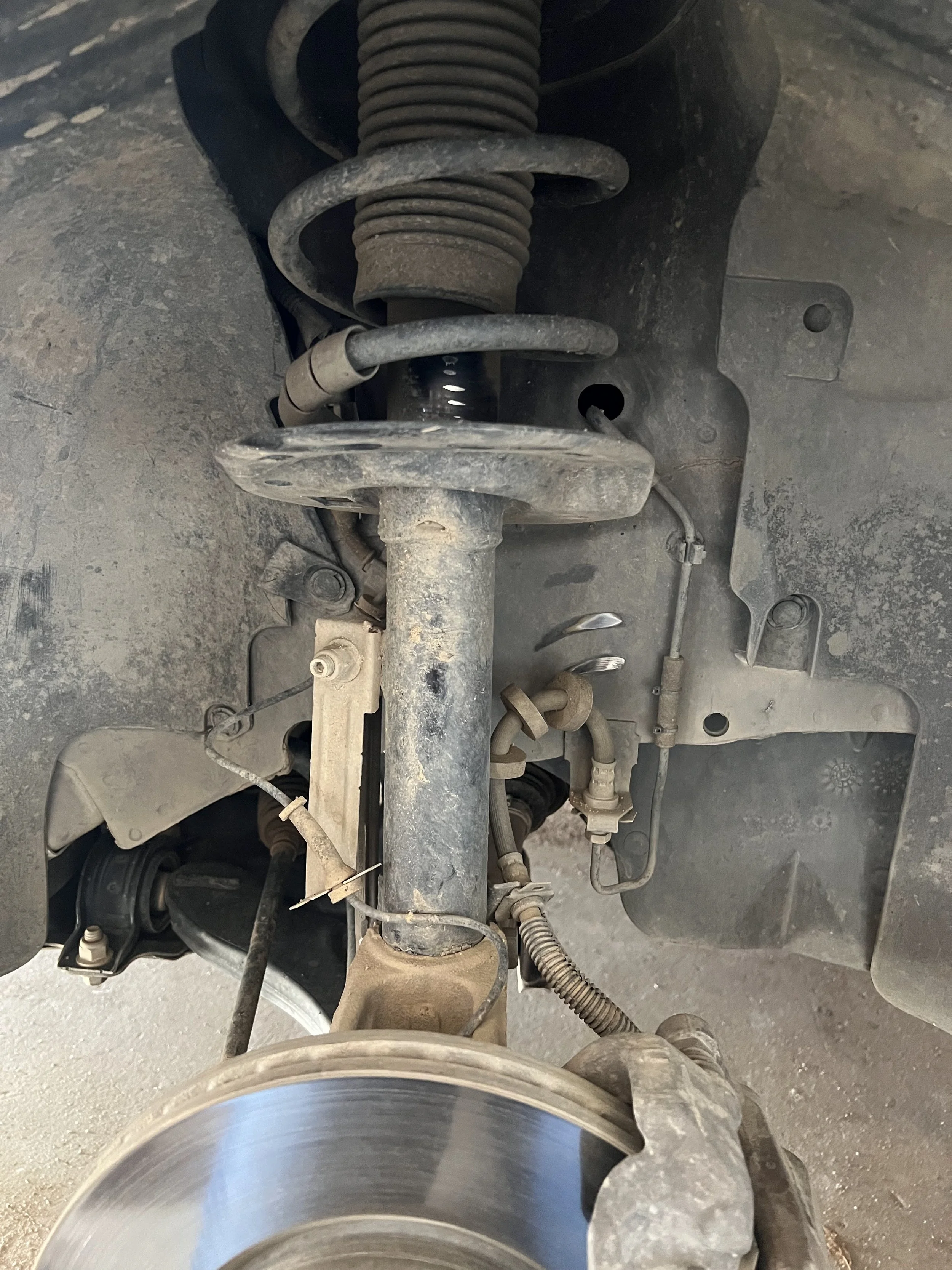 Overview of the front suspension on a 2010 Ford Focus SE.