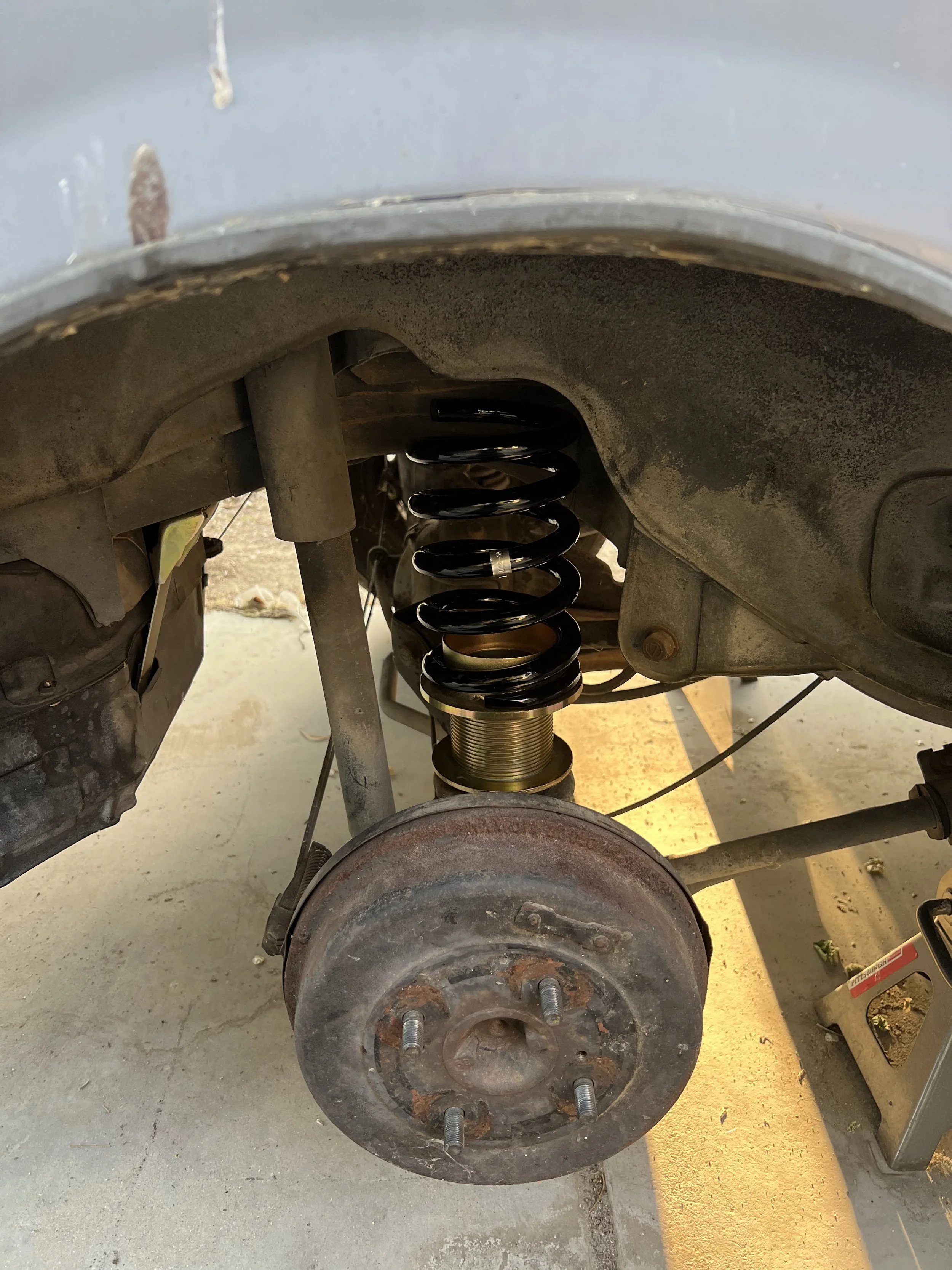 Overview of a 1984 Nissan 200SX S12 with a new lowering spring and perch setup.