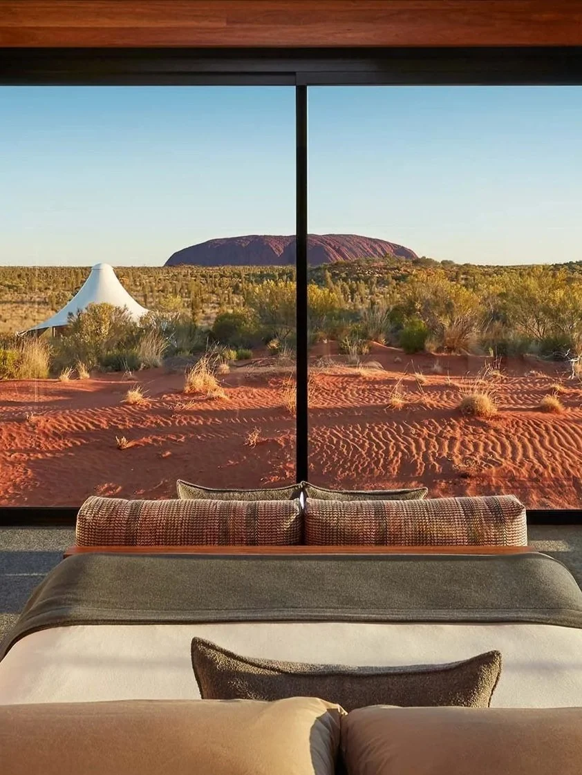 Exclusive view of Uluru from a luxury bedroom suite in Australia on a luxury travel journey, designed by Piper Travel Design