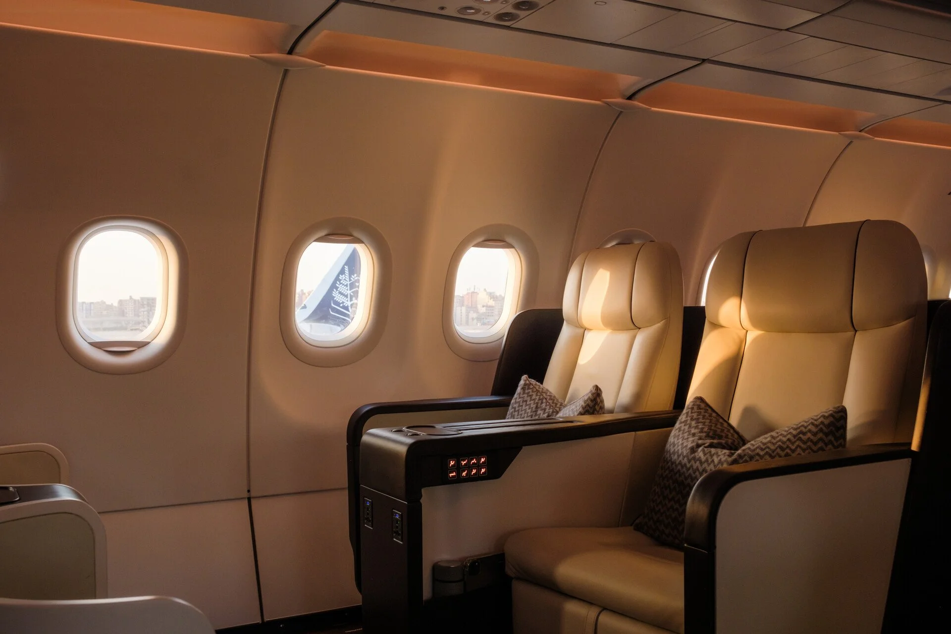 A custom private jet on the apron at dawn, stairs down, prepared for a round-the-world expedition departure.