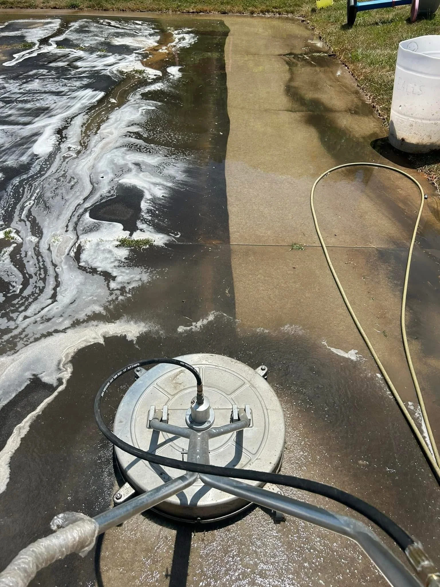 concrete getting surface cleaned pressure washed 