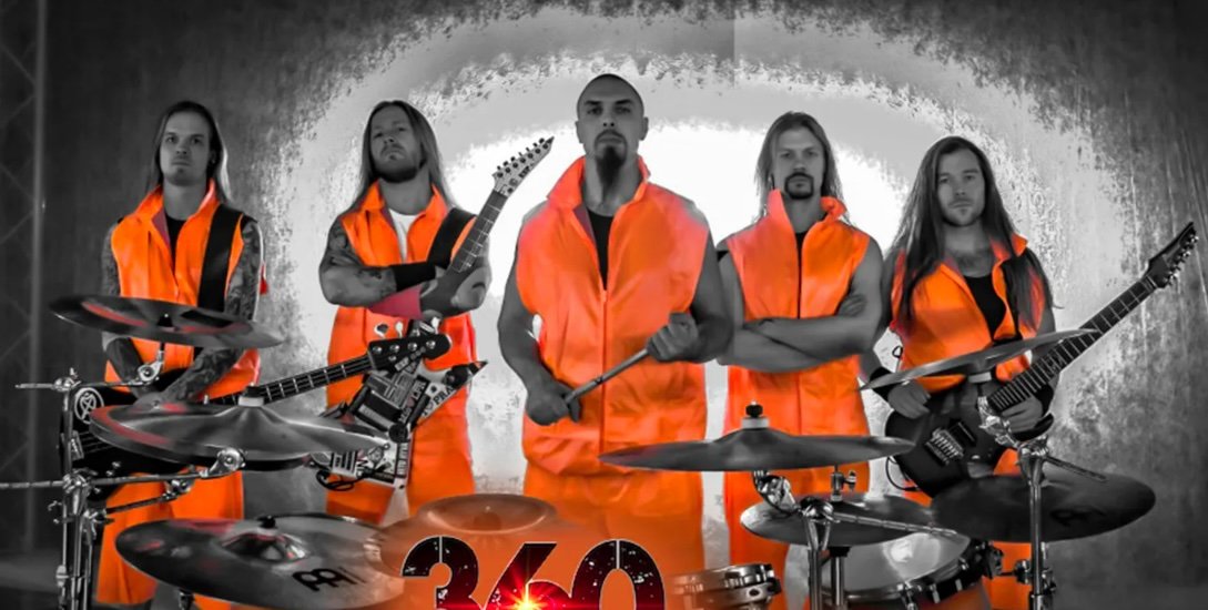 A rock band Stam1na with five members wearing neon orange outfits, holding guitars and standing behind drums, with a stylized "360" logo at the front.