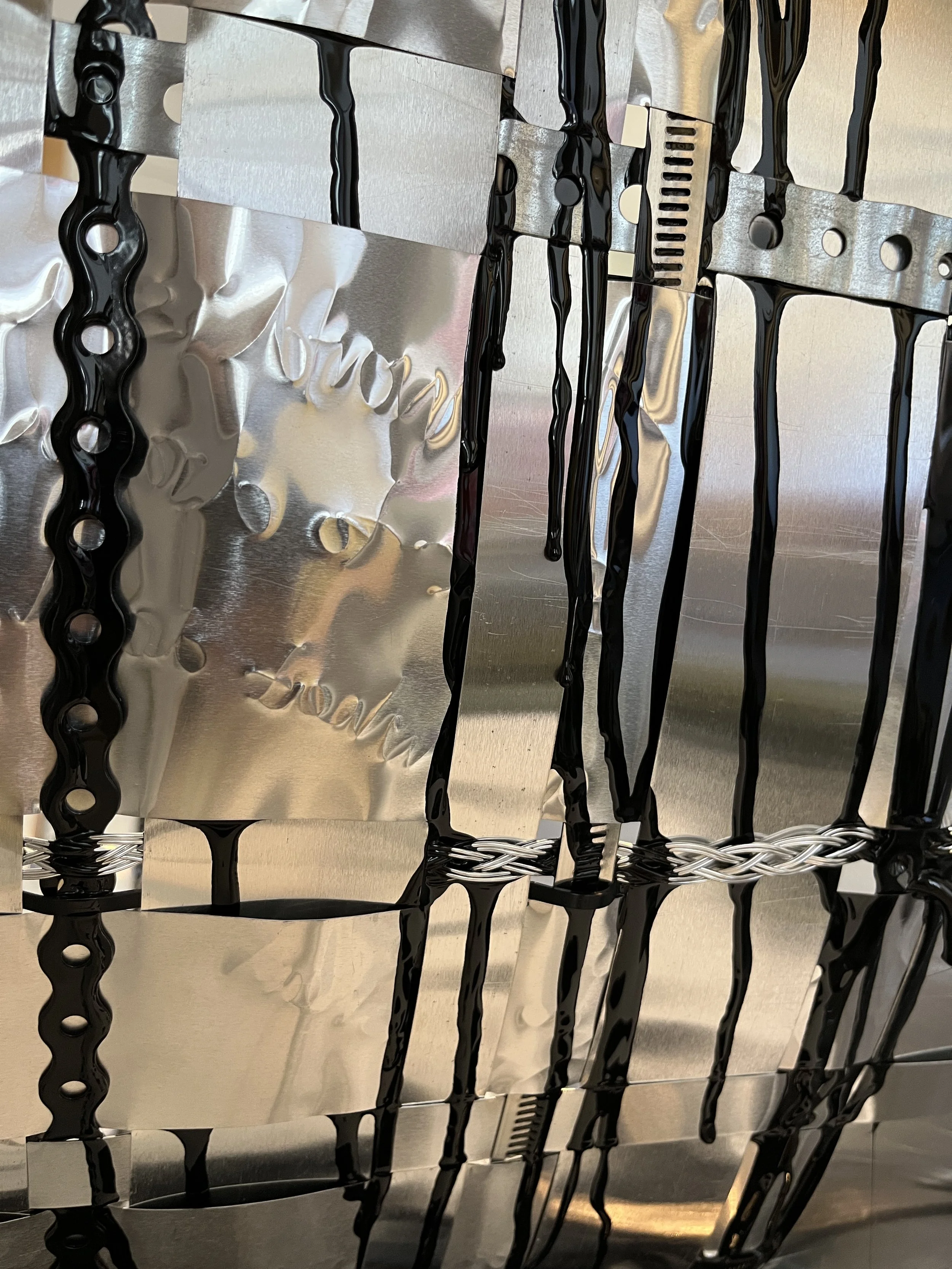 Close up of Fay Raylene woven aluminium piece 'Sadness is an Oil Spill in my Mind'