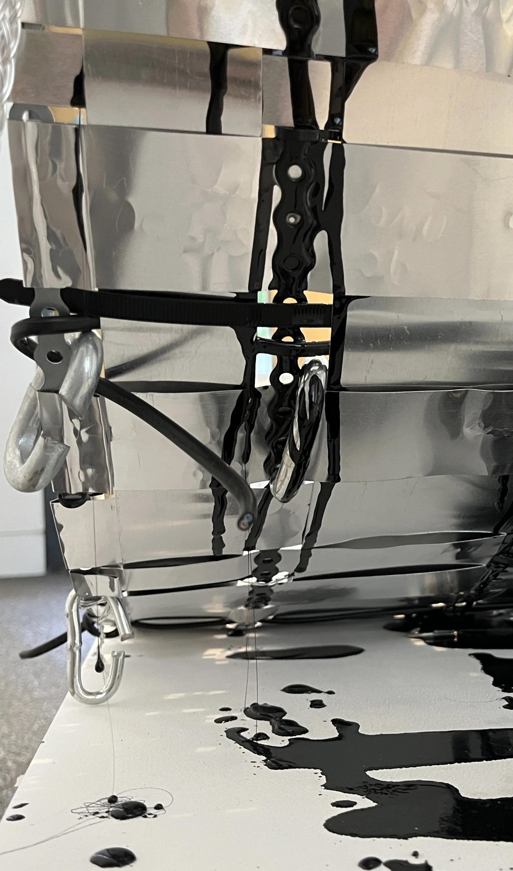 Close up of Fay Raylene woven aluminium piece 'Sadness is an Oil Spill in my Mind'