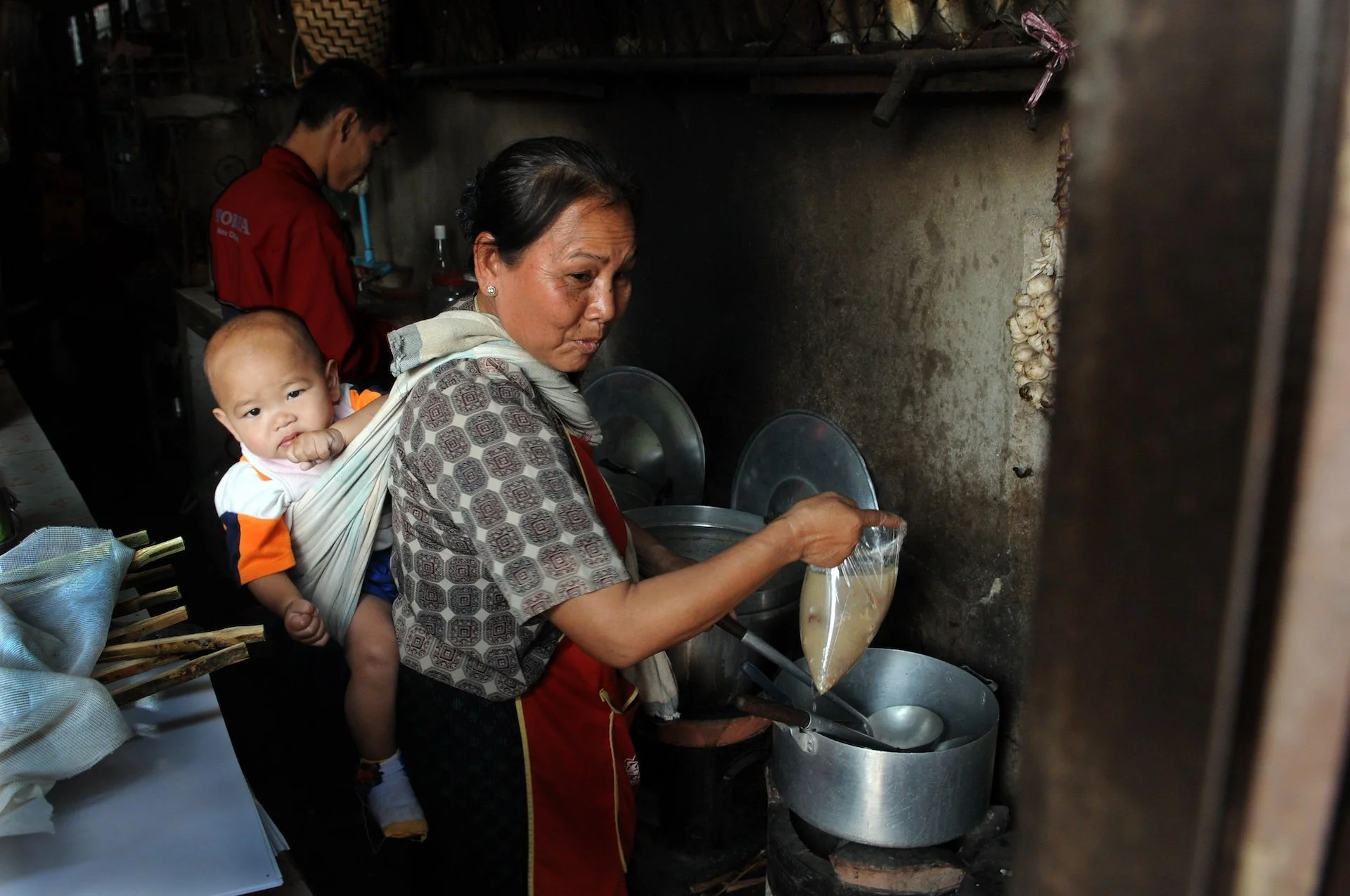Grandmother with grandchild in food shop