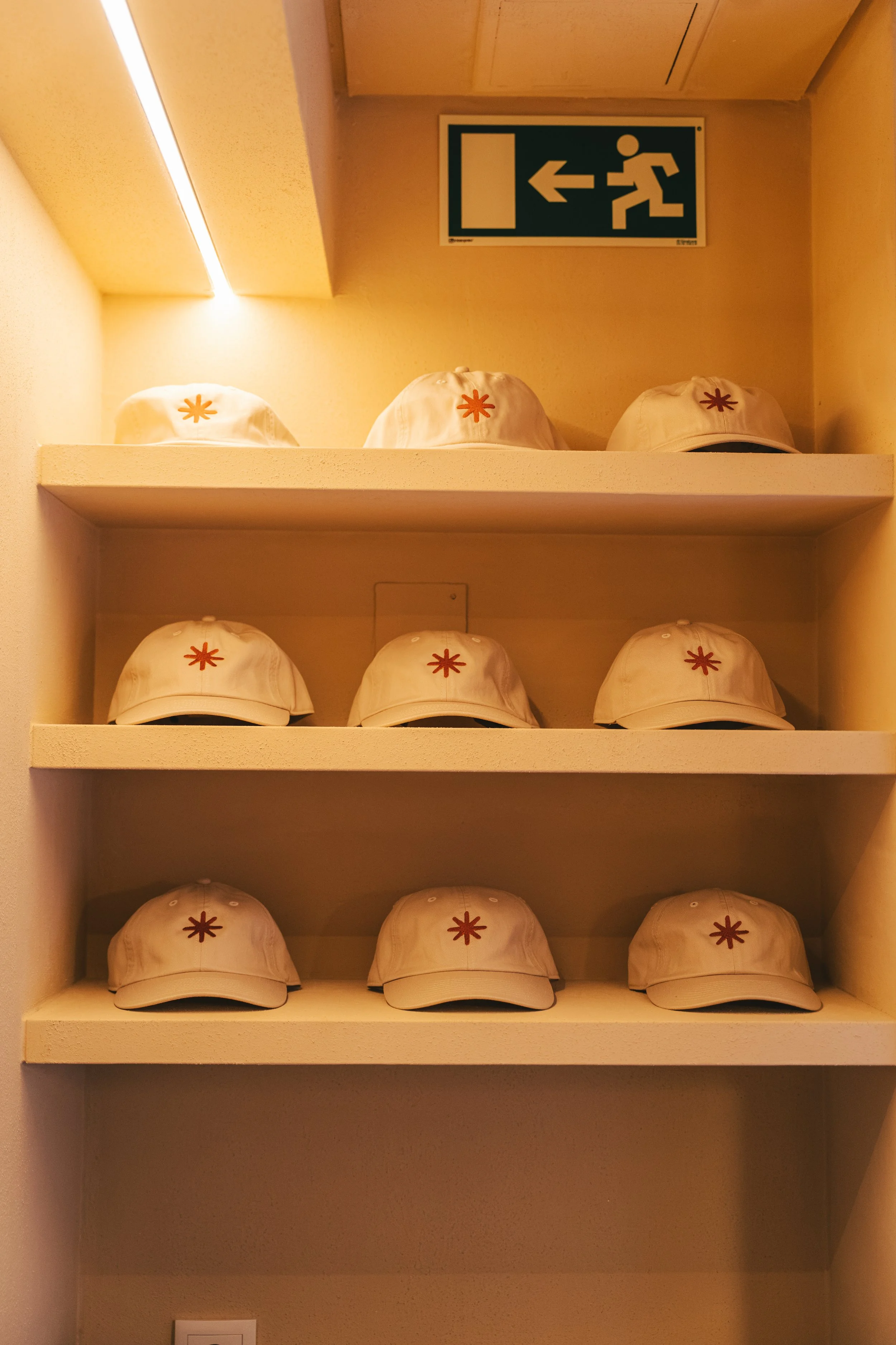 Reset Society caps on wooden shelves