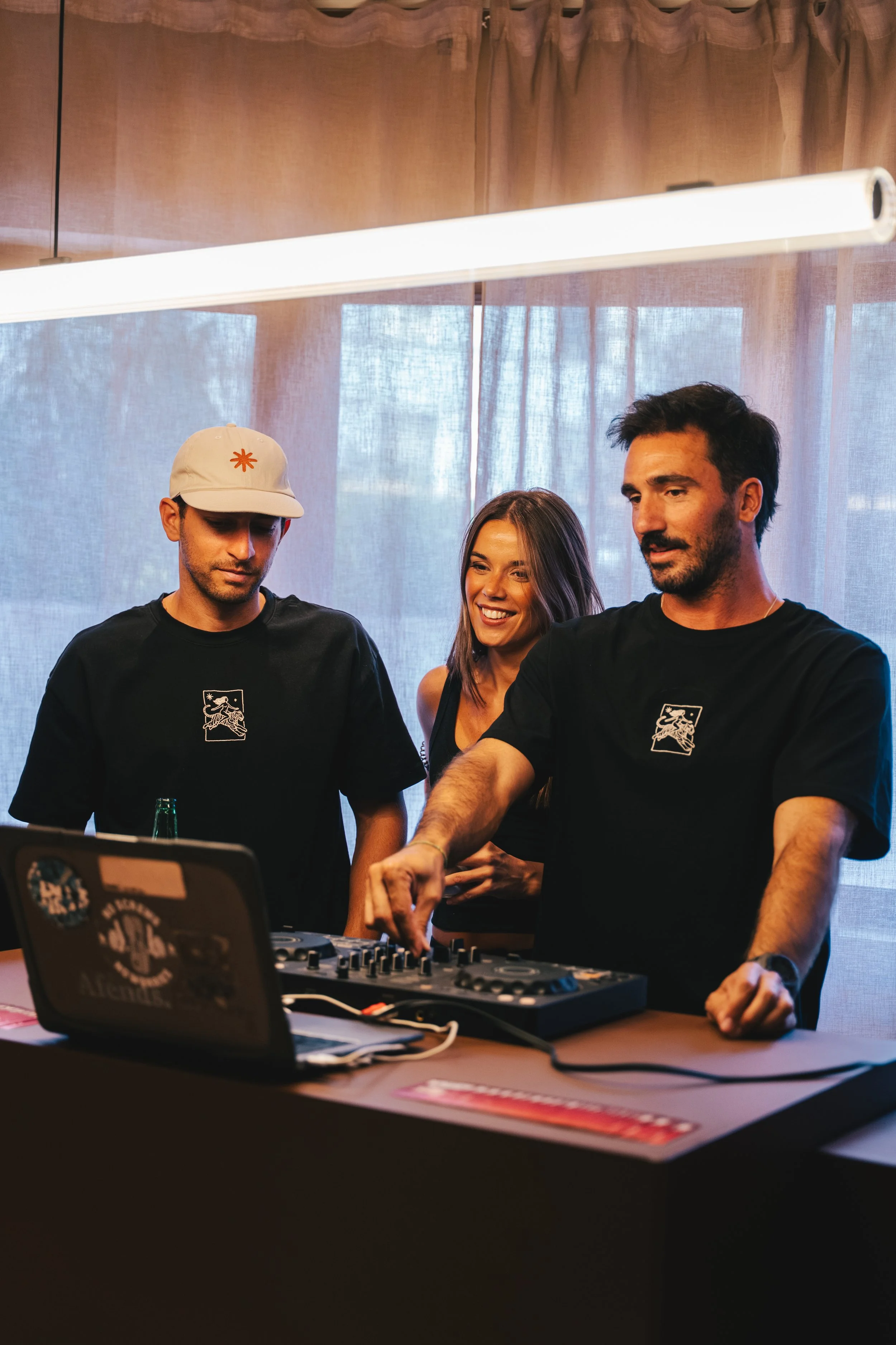 Reset Society team at the DJ booth during the opening party