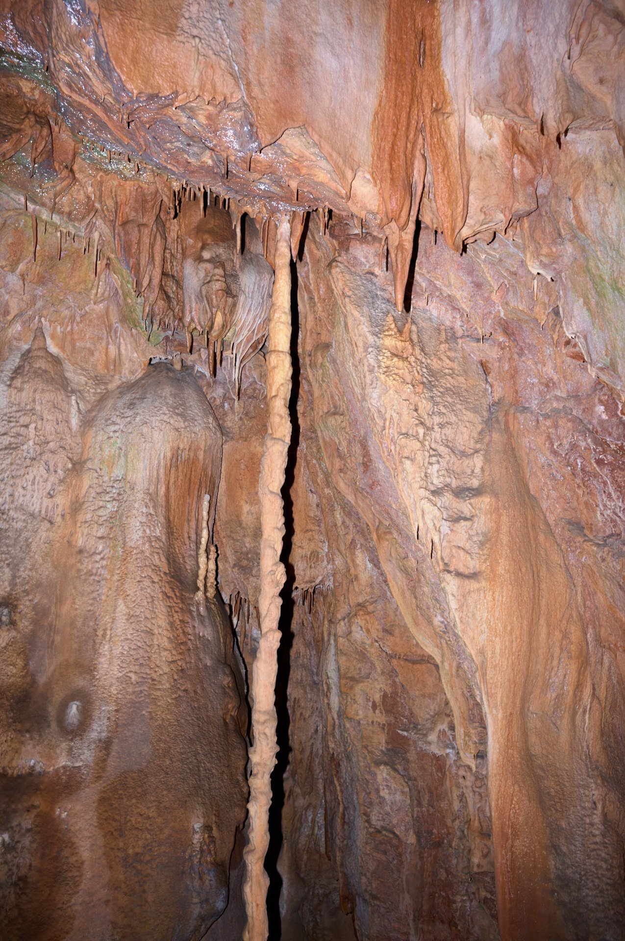 Stalactites and stalagnates inside a cave.