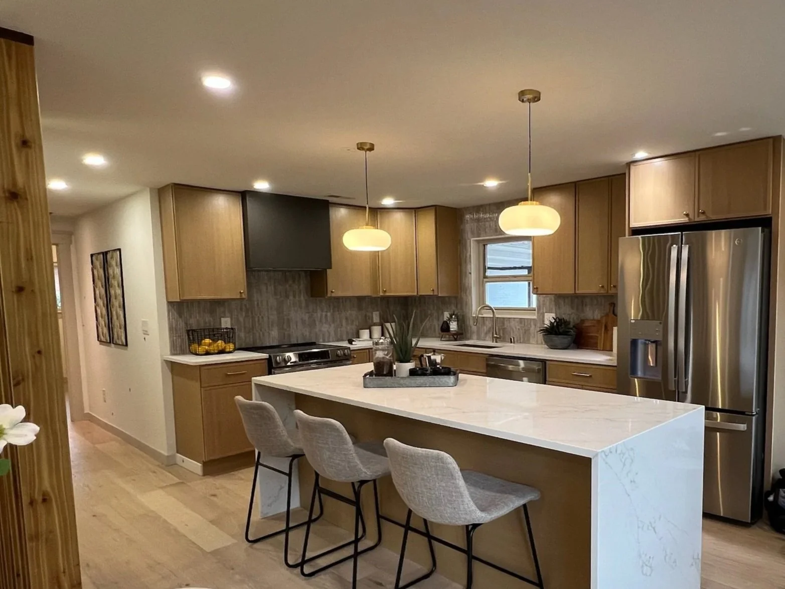 Modern kitchen renovation with custom cabinetry and premium finishes, showcasing Barrett Homes' fix-and-flip and residential investment expertise
