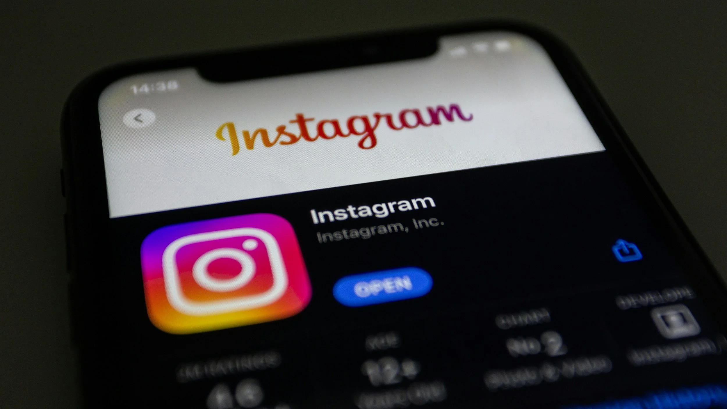 Close-up of a smartphone screen displaying the Instagram app and the Instagram logo.