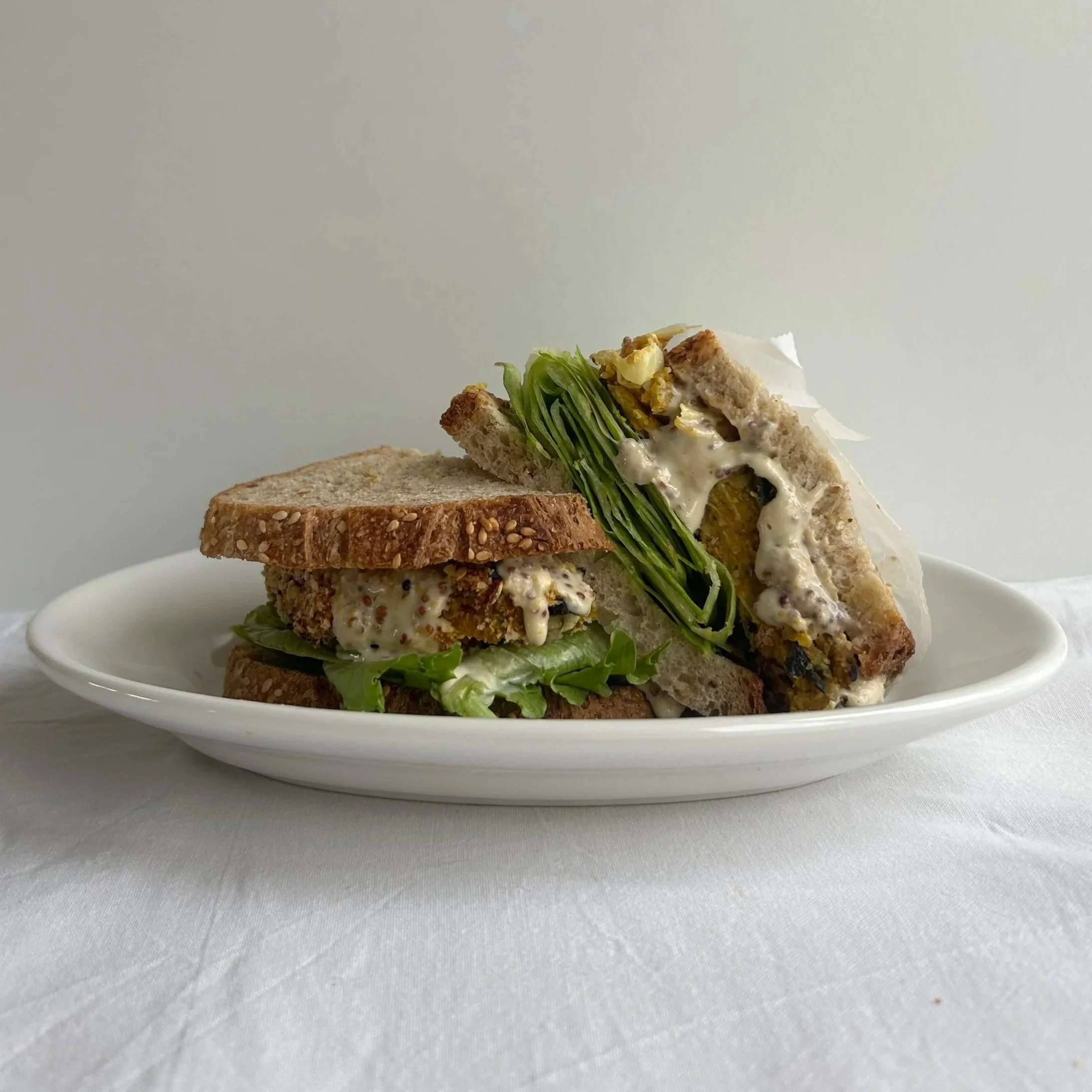 Curried butternut squash chickpea croquette &amp; lemon mustard tahini sando